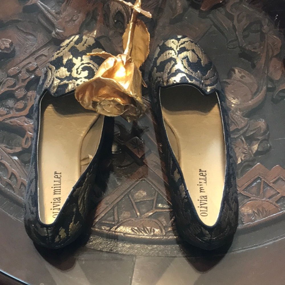 Pretty gold and black flats from Olivia Miller